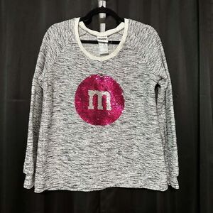 M&M’s sweater in a heather black/white and gray in a space dyed type style with